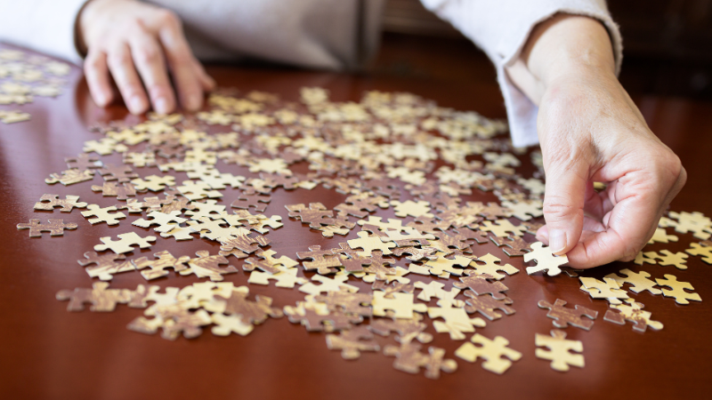 What Type of People Like Doing Jigsaw Puzzles - Puzzle pieces on a table